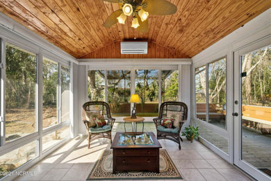 Example of an arts and crafts sunroom design in Other
