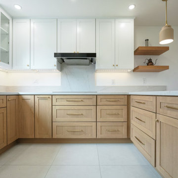 Modern White and Natural Oak Kitchen with Brass Hardware and Quartz Backsplash