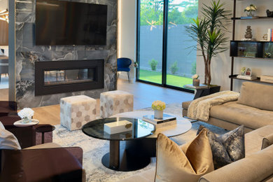 Living room - large modern formal and open concept light wood floor, beige floor and wallpaper living room idea in Houston with white walls, a two-sided fireplace, a tile fireplace and a wall-mounted tv