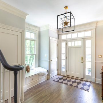 Custom Foyer with Statement Lighting and Built-In Seating