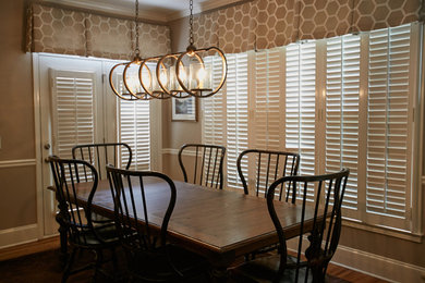 Example of a transitional medium tone wood floor kitchen/dining room combo design in Atlanta