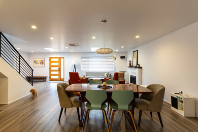Great room - mid-sized contemporary medium tone wood floor and brown floor great room idea in Other with white walls