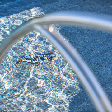 Custom Inground Pool with Firebowls, Spa and Pergola.