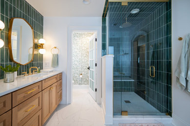 Corner shower - mid-sized transitional master green tile and porcelain tile porcelain tile, white floor, double-sink and wallpaper corner shower idea in Chicago with flat-panel cabinets, medium tone wood cabinets, an undermount tub, a one-piece toilet, white walls, an undermount sink, quartz countertops, a hinged shower door, white countertops and a built-in vanity