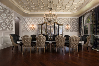 This is an example of an expansive transitional separate dining room in Chicago with dark hardwood floors, no fireplace, grey walls and brown floor.