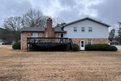 Mid-sized rustic one-story exterior home idea in Other