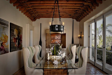 Enclosed dining room - mid-sized terra-cotta tile and brown floor enclosed dining room idea in San Diego with white walls and no fireplace