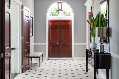 Inspiration for a large transitional porcelain tile and multicolored floor entryway remodel in Other with gray walls and a medium wood front door