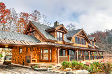 Mountain style brown shingle exterior home photo in New York