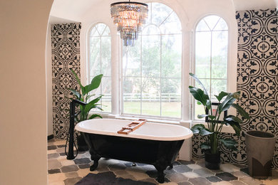 Tuscan white tile and mosaic tile mosaic tile floor claw-foot bathtub photo in Salt Lake City with marble countertops