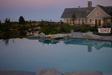 Beach style pool photo in Portland Maine