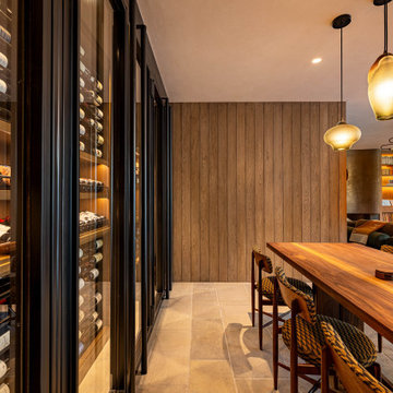 Modern Bronze Steel Wine Wall and Liquor Display in Luxury Custom Home Basement