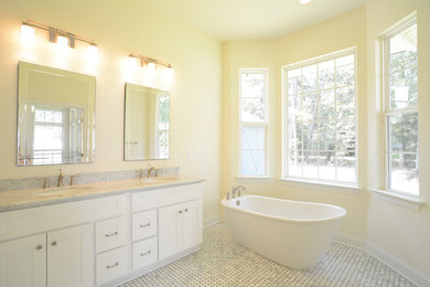 Inspiration for a mid-sized craftsman master white tile marble floor bathroom remodel in New Orleans with an undermount sink, shaker cabinets, white cabinets, marble countertops and a one-piece toilet
