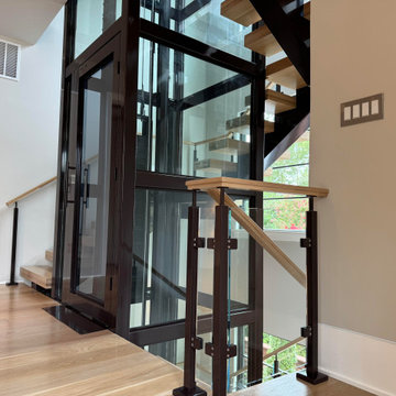 Project #136 | Modern Floating Staircase Encircling Glass Elevator