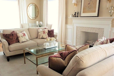 Example of a large classic formal and open concept medium tone wood floor and brown floor living room design in Boston with beige walls, a standard fireplace, a wood fireplace surround and no tv