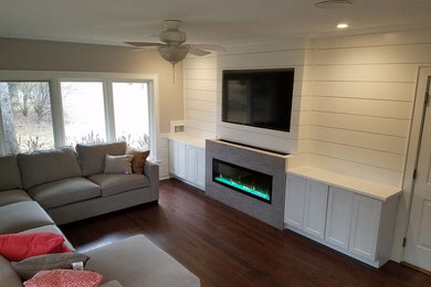 Living room - mid-sized transitional dark wood floor and brown floor living room idea in Other with beige walls, a ribbon fireplace, a tile fireplace and a wall-mounted tv