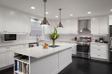 Open concept kitchen - large contemporary l-shaped dark wood floor open concept kitchen idea in Chicago with an undermount sink, shaker cabinets, white cabinets, marble countertops, white backsplash, subway tile backsplash, stainless steel appliances and an island
