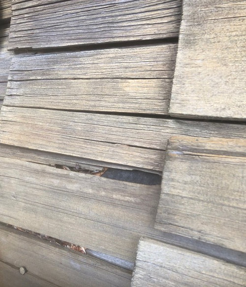 Calling roofers exposed nails on cedar shake roof