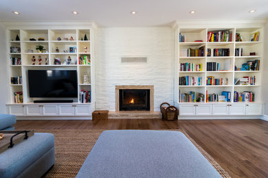 Transitional dark wood floor living room photo in Montreal with a standard fireplace