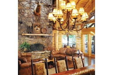Example of a mid-sized mountain style open concept dark wood floor living room design in Other with a standard fireplace and a stone fireplace