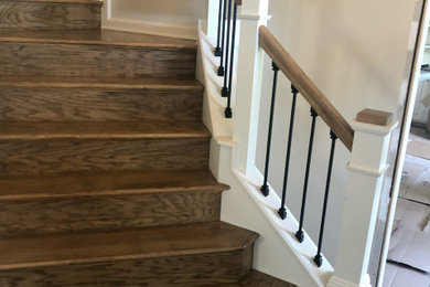 Inspiration for a mid-sized craftsman wooden l-shaped wood railing staircase remodel in Indianapolis with painted risers