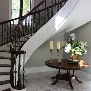 Walnut Circular Stair with Twist & Basket Iron Balusters
