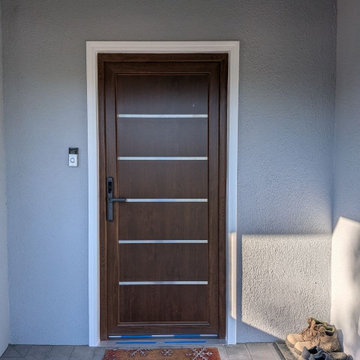 Modern Wood Entry Door with Horizontal Metal Inserts