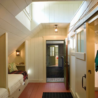 Design ideas for a country guest bedroom in Atlanta with red floor.