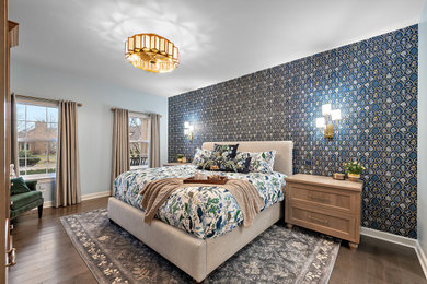 Mid-sized transitional master dark wood floor, brown floor and wallpaper bedroom photo in Detroit with blue walls and no fireplace