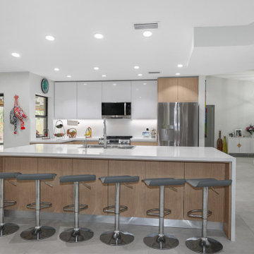 Modern Kitchen with Sleek Island and High-End Stainless Steel Appliances in West