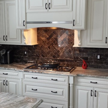 Antique White Kitchen with Mahogany Island.