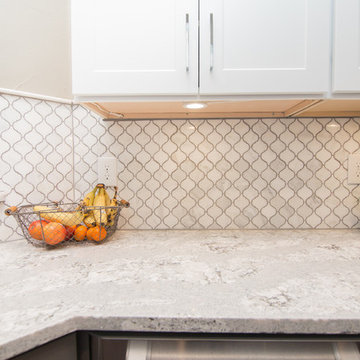Kitchen | Two-Tone Cabinets | Cambria Quartz | Arabesque Marble Backsplash
