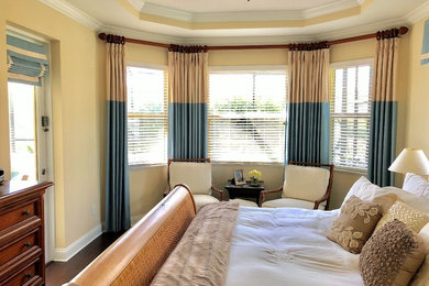 Island style master brown floor bedroom photo in Orlando