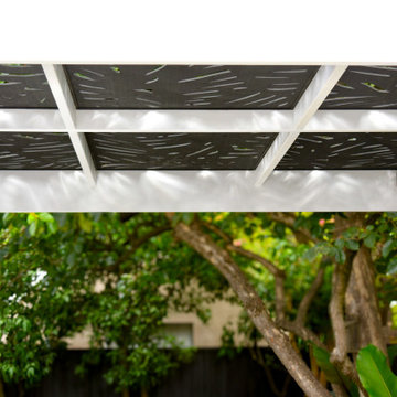 Under the Custom-Designed Pergola: Tropical Cut-Out Trellis and Ambient Lighting
