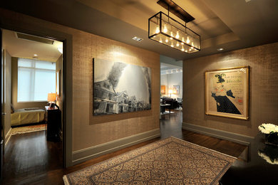 Inspiration for a modern medium tone wood floor entryway remodel in New York with beige walls