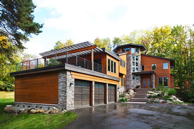 Contemporary exterior in Detroit with wood siding.