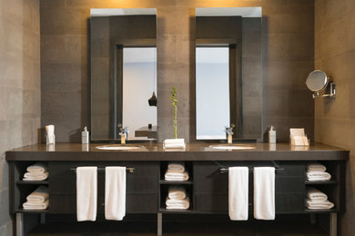 Example of a mid-sized trendy master double-sink bathroom design in London with gray cabinets