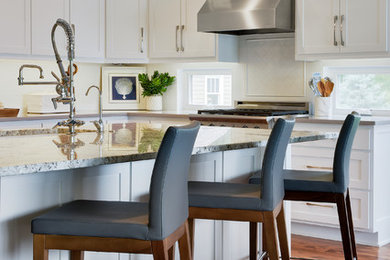 Open concept kitchen - mid-sized contemporary medium tone wood floor and brown floor open concept kitchen idea in Phoenix with a double-bowl sink, flat-panel cabinets, white cabinets, quartz countertops, white backsplash, ceramic backsplash, stainless steel appliances, an island and gray countertops