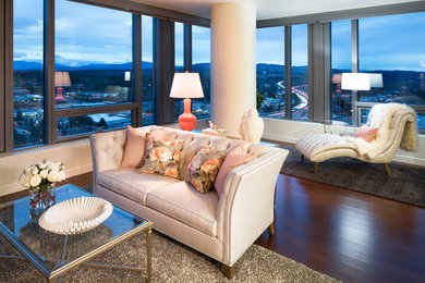 Small trendy enclosed medium tone wood floor and brown floor living room photo in Seattle with white walls, a standard fireplace, a wall-mounted tv and a plaster fireplace
