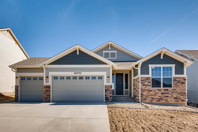 Example of a classic blue one-story mixed siding exterior home design in Denver with a shingle roof