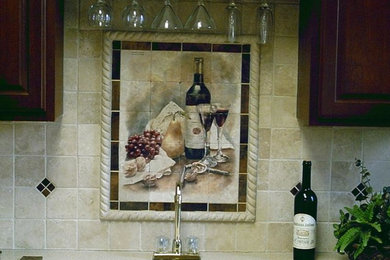 Kitchen photo in Kansas City with an integrated sink, raised-panel cabinets, medium tone wood cabinets, laminate countertops, multicolored backsplash and ceramic backsplash