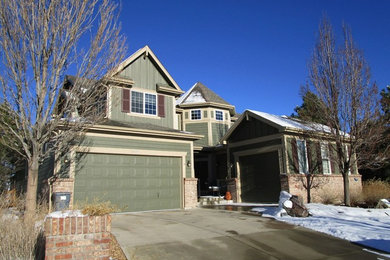 Mid-sized traditional green two-story mixed siding house exterior idea in Denver with a clipped gable roof and a shingle roof