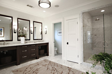 Elegant gray tile alcove shower photo in Atlanta with dark wood cabinets and open cabinets