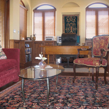 Antique Persian Rugs Displayed on both Wall & Floor Unify the Gentleman’s Office