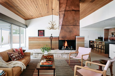 Example of a southwest formal and open concept limestone floor and gray floor living room design in Other with white walls