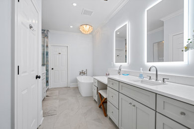 Bathroom - mid-sized modern master double-sink bathroom idea in Charleston with gray cabinets, a built-in vanity, gray walls and a hinged shower door