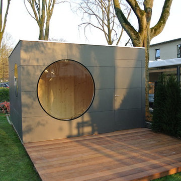 Gartenkubus mit Terrasse und Holzablagemöglichkeit