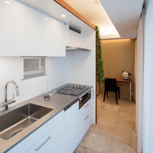 Modern kitchen pantry ideas - Kitchen pantry - modern single-wall marble floor and beige floor kitchen pantry idea in Tokyo with an integrated sink, flat-panel cabinets, white cabinets, stainless steel countertops, white backsplash, white appliances and no island