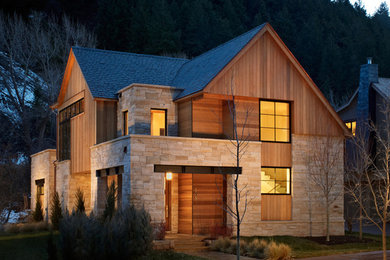 This is an example of a large contemporary two-storey brown exterior in Denver with wood siding and a hip roof.