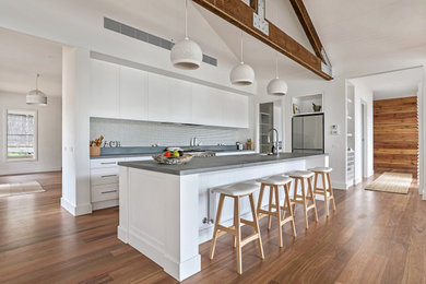 This is an example of a traditional open plan kitchen in Melbourne with with island.